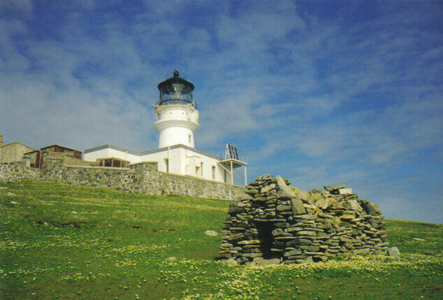 St Flannan's Cell, with the lighthouse behind